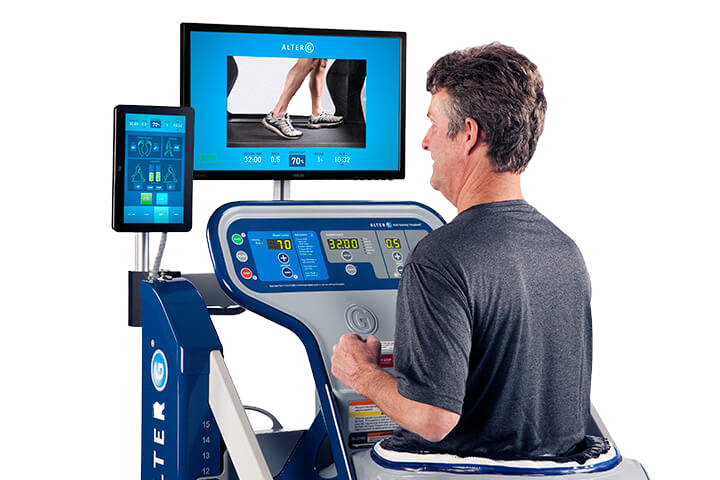 A man running on the Alter G featuring the tablet and video system.
